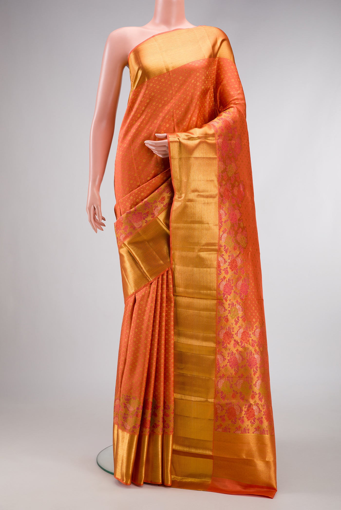 Pure Silk Pure Zari Peach Dual Tone Kanjivaram Saree with Zari Brocade on the body and Zari Border.  displayed on a mannequin