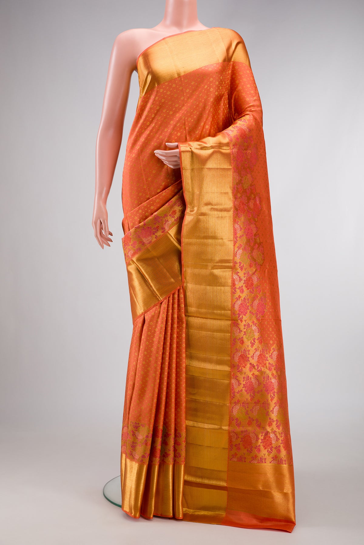 Pure Silk Pure Zari Peach Dual Tone Kanjivaram Saree with Zari Brocade on the body and Zari Border.  displayed on a mannequin