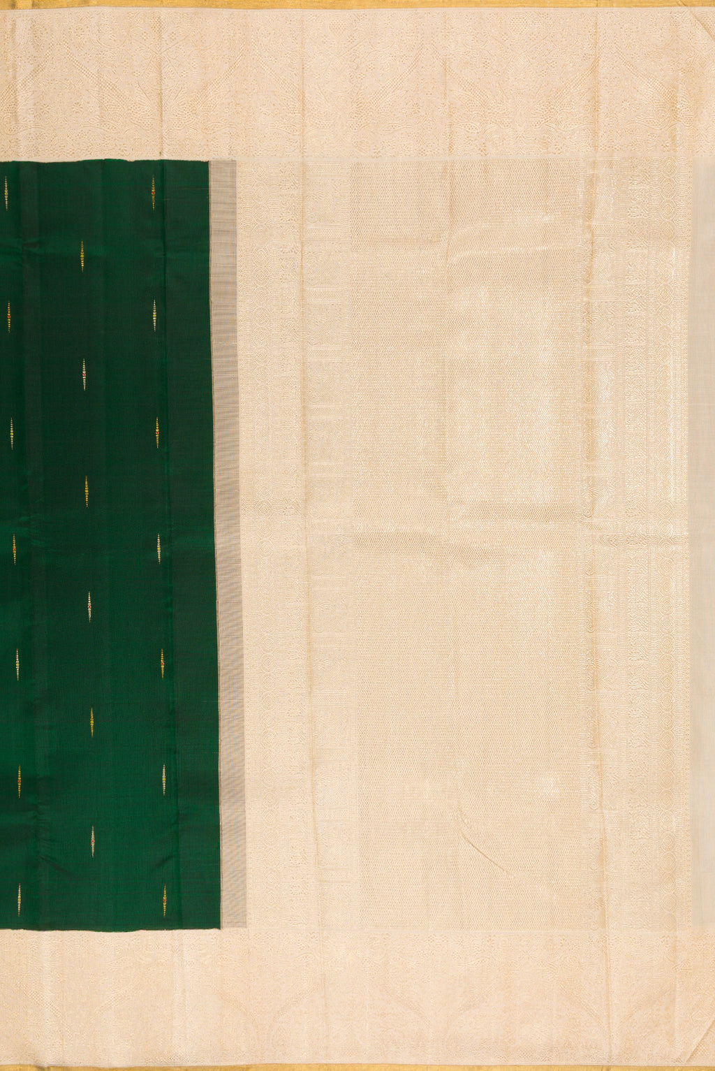 Close up image of the pallu of Pure Silk Pure Zari Bottle Green Kanjivaram Saree with Zari Butta on the body and Zari Border. 