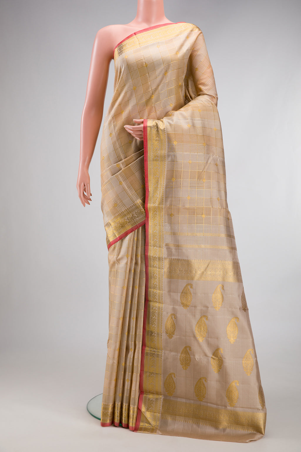 Pure Silk Pure Zari Beige Kanchipuram Saree with Checked design on the body and Zari Border.  displayed on a mannequin