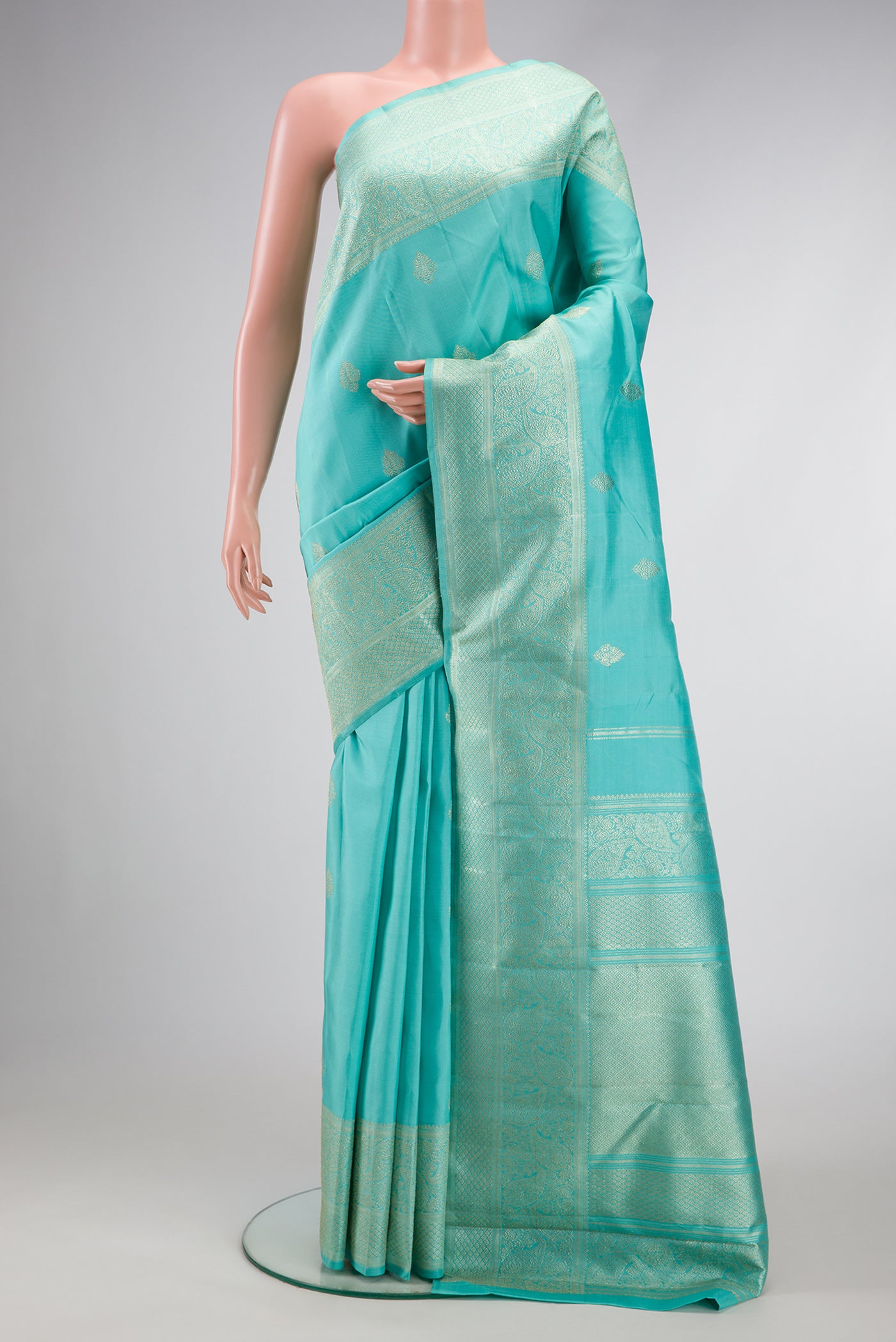 Sky Blue Dual Tone Kanjivaram Silk Saree with Zari Butta on the body and Fancy Border.  displayed on a mannequin