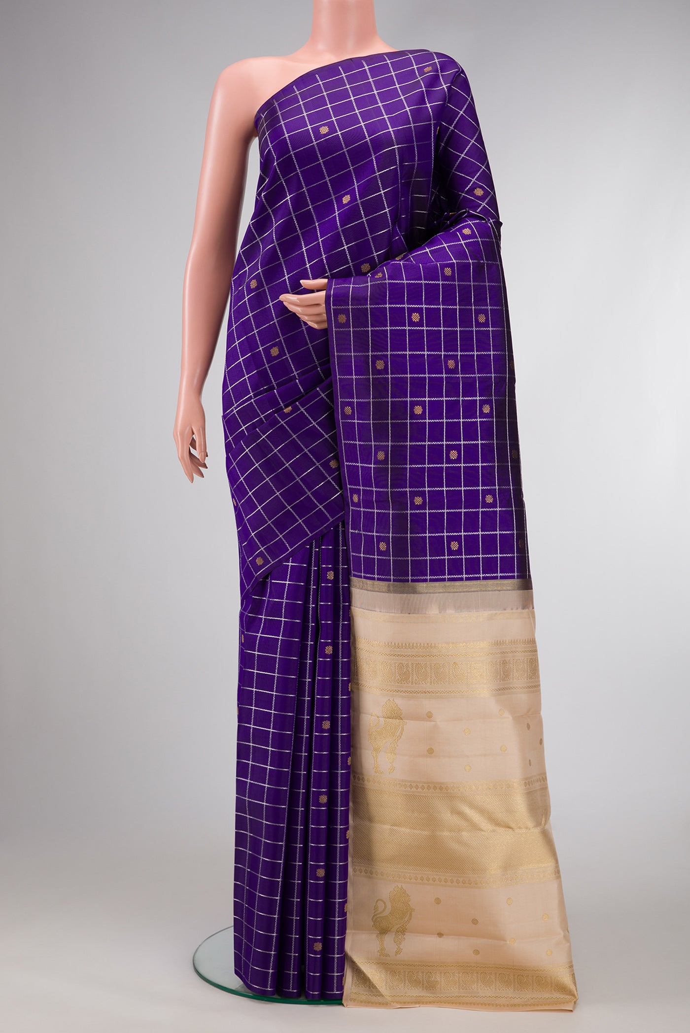 Pure Silk Pure Zari Violet Dual Tone Kanjivaram Saree with Checked design on the body and Without Border.  displayed on a mannequin