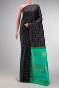 Pure Silk Pure Zari Black Dual Tone Kanjivaram Saree with Checked design on the body and Without Border.  displayed on a mannequin