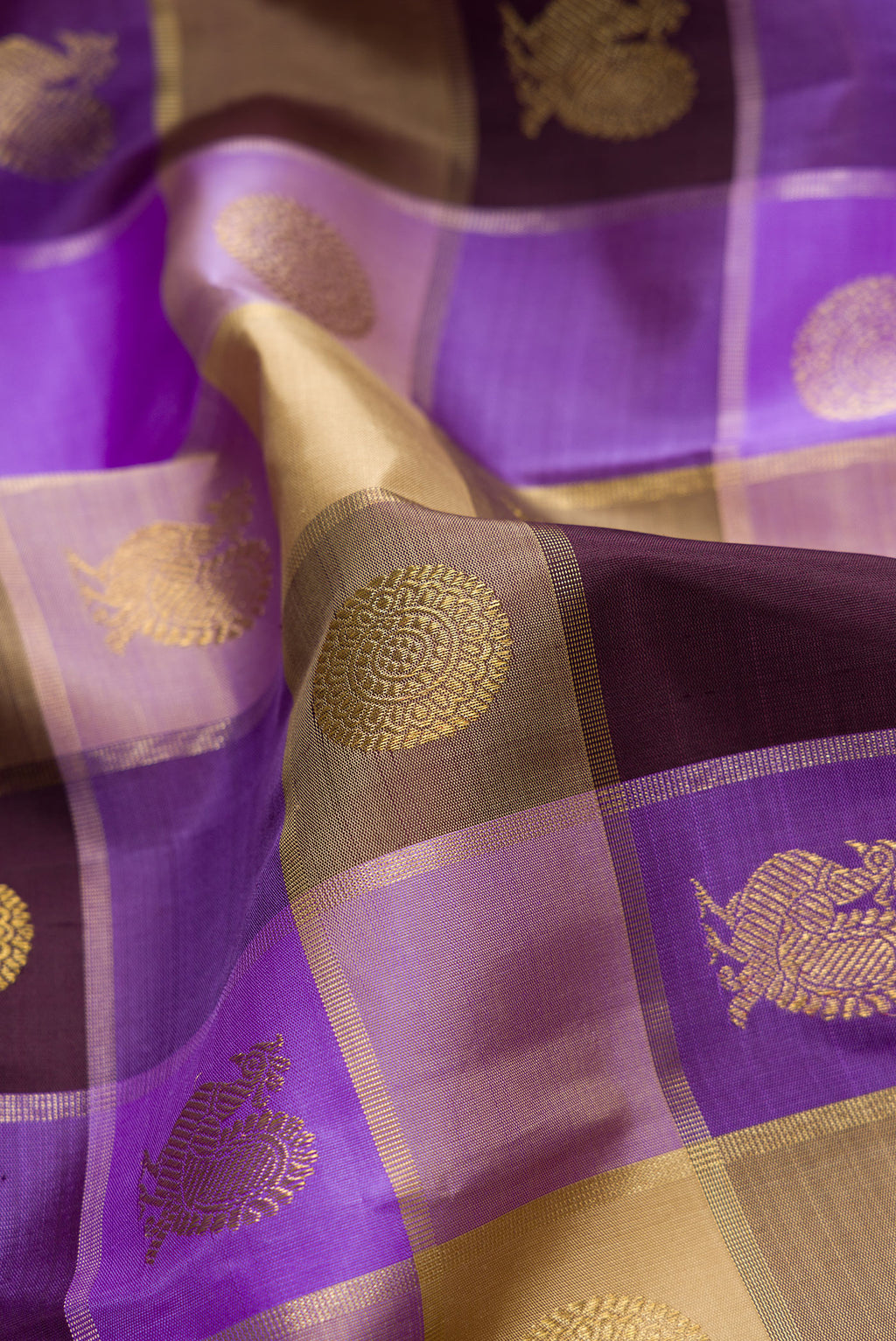 Close up of Lavender, Beige and Coffee Brown Color Kanjivaram Silk Saree with Checked design on the body and Without Border.  displaying folds