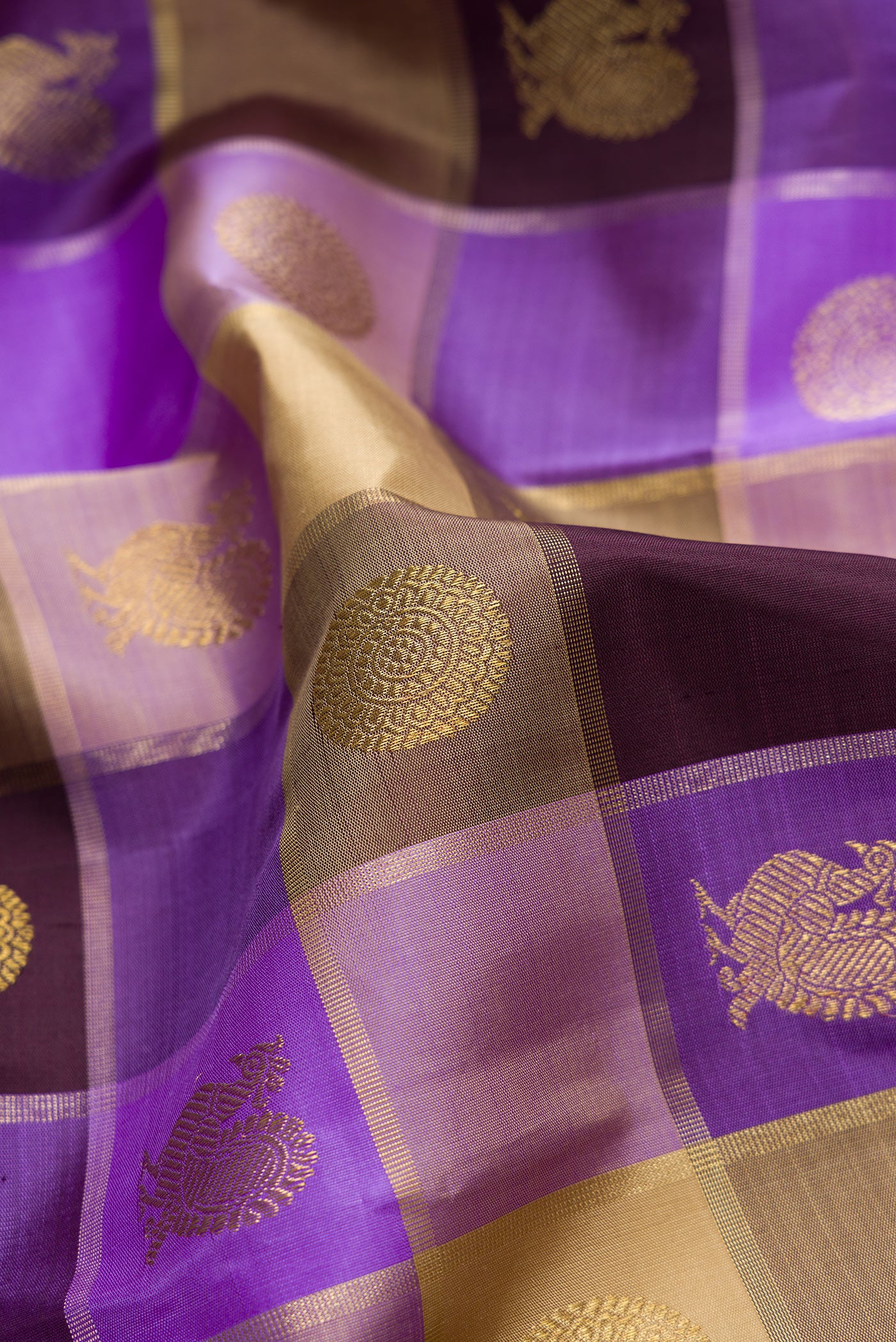 Close up of Lavender, Beige and Coffee Brown Color Kanjivaram Silk Saree with Checked design on the body and Without Border.  displaying folds