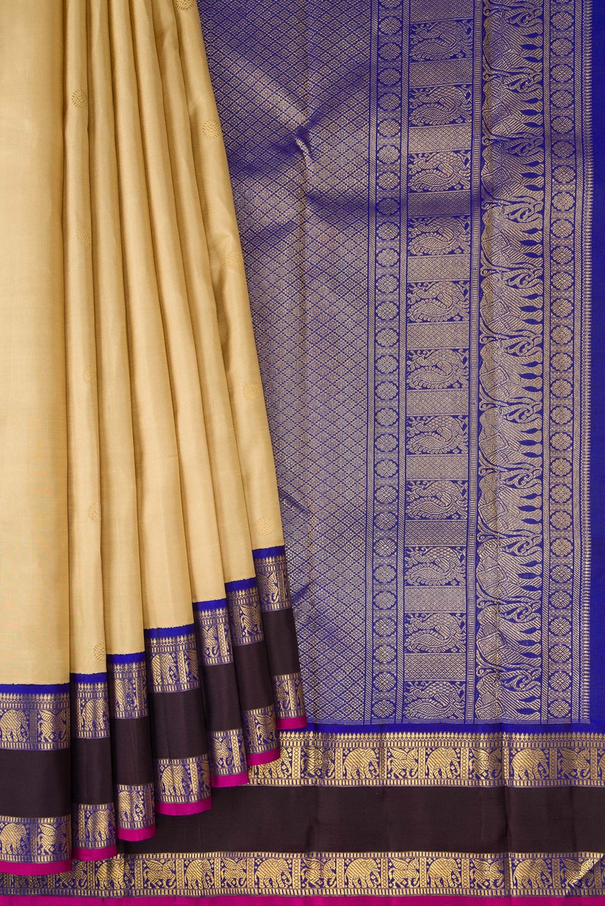 Pleats and pallu of Pure Silk Pure Zari Beige Kanjivaram Saree with Zari Butta on the body and Zari Border. 