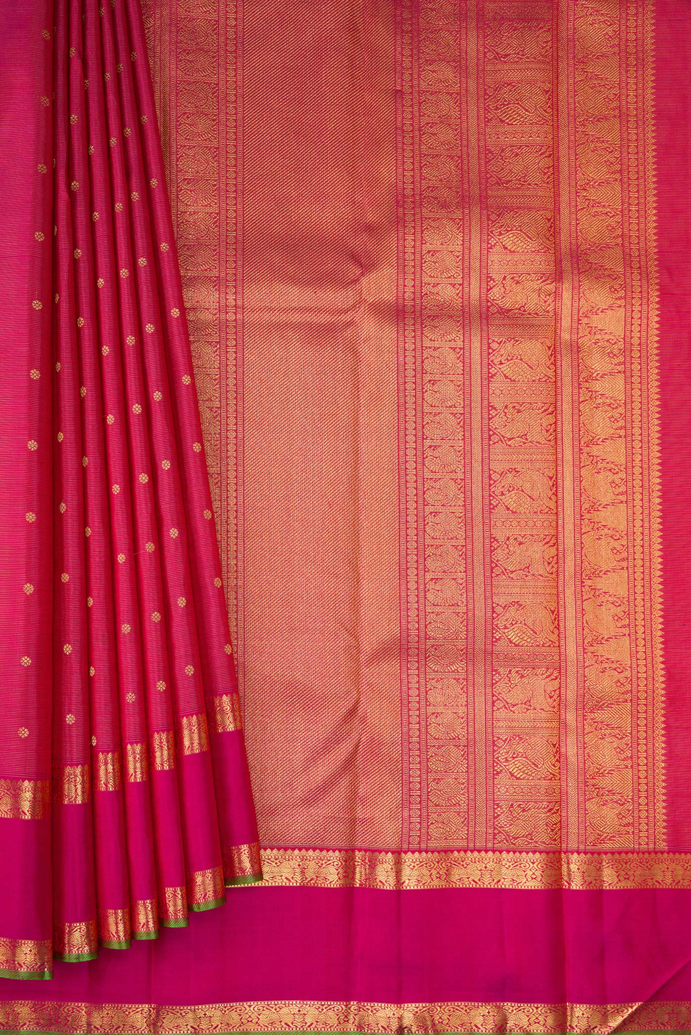 Pleats and pallu of Pure Silk Pure Zari Rani Pink Kanjivaram Saree with Zari Butta on the body and Zari Border. 