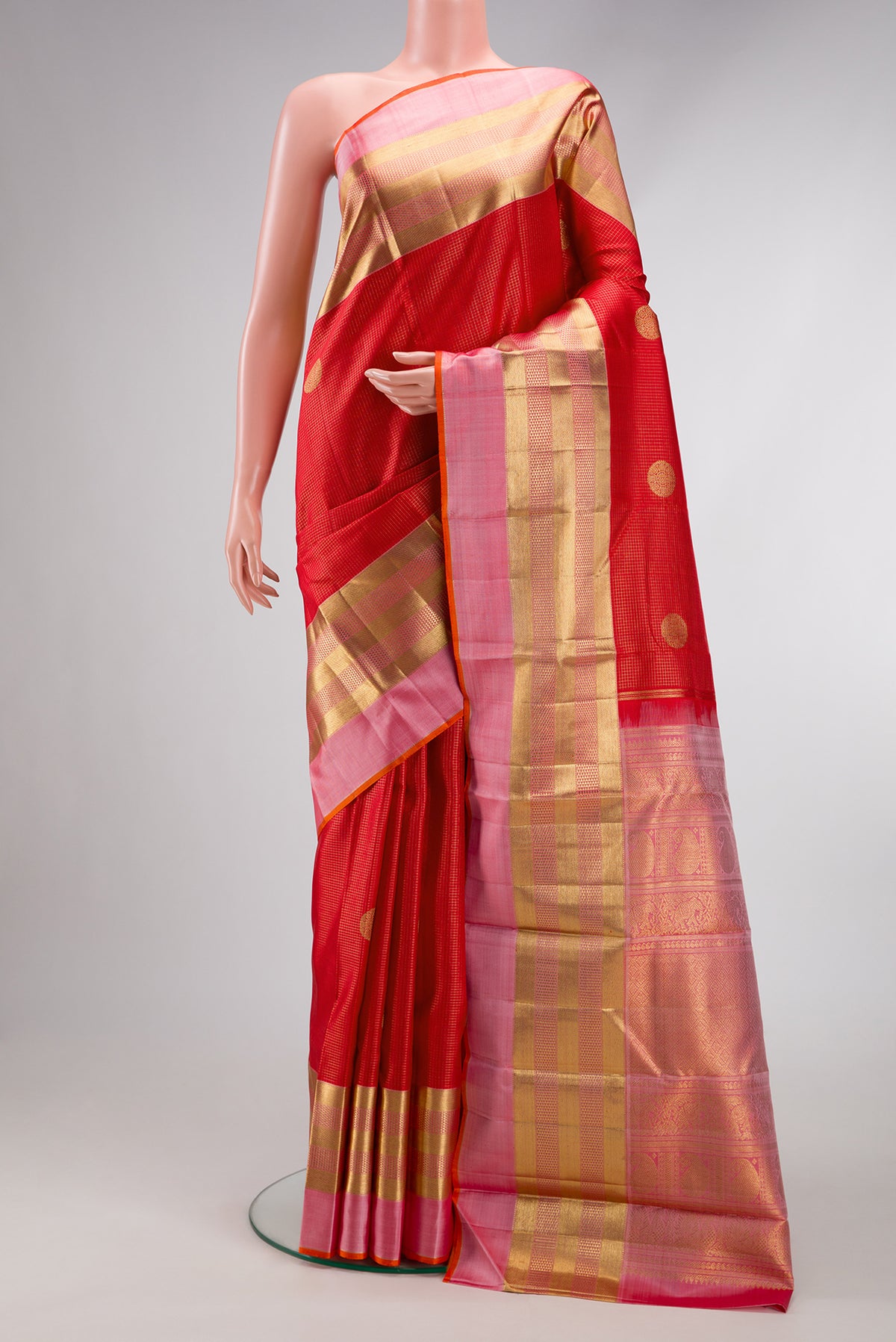 Pure Silk Pure Zari Red Dual Tone Kanjivaram Saree with Checked design on the body and Zari Border.  displayed on a mannequin