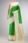 Pure Silk Pure Zari Parrot Green Dual Tone Kanjivaram Saree with Checked design on the body and Zari Border.  displayed on a mannequin