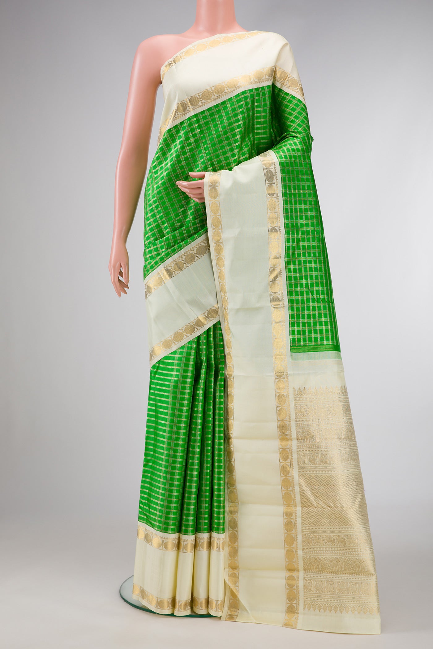 Pure Silk Pure Zari Parrot Green Dual Tone Kanjivaram Saree with Checked design on the body and Zari Border.  displayed on a mannequin
