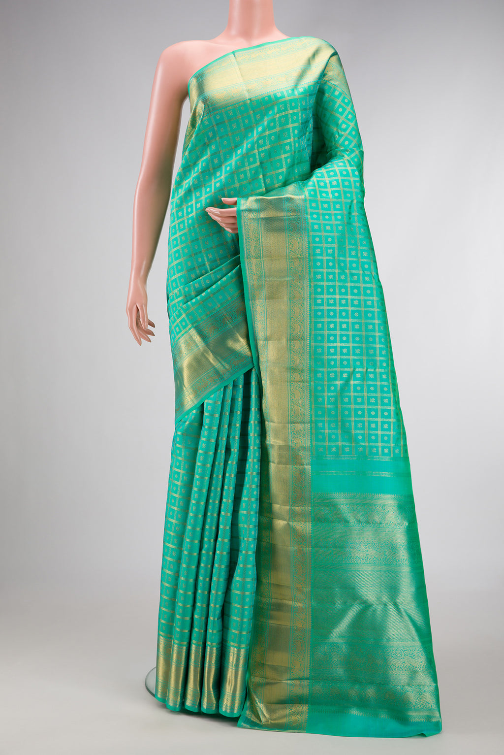 Pure Silk Pure Zari Sea Green Dual Tone Kanjivaram Saree with Zari Brocade on the body and Zari Border.  displayed on a mannequin