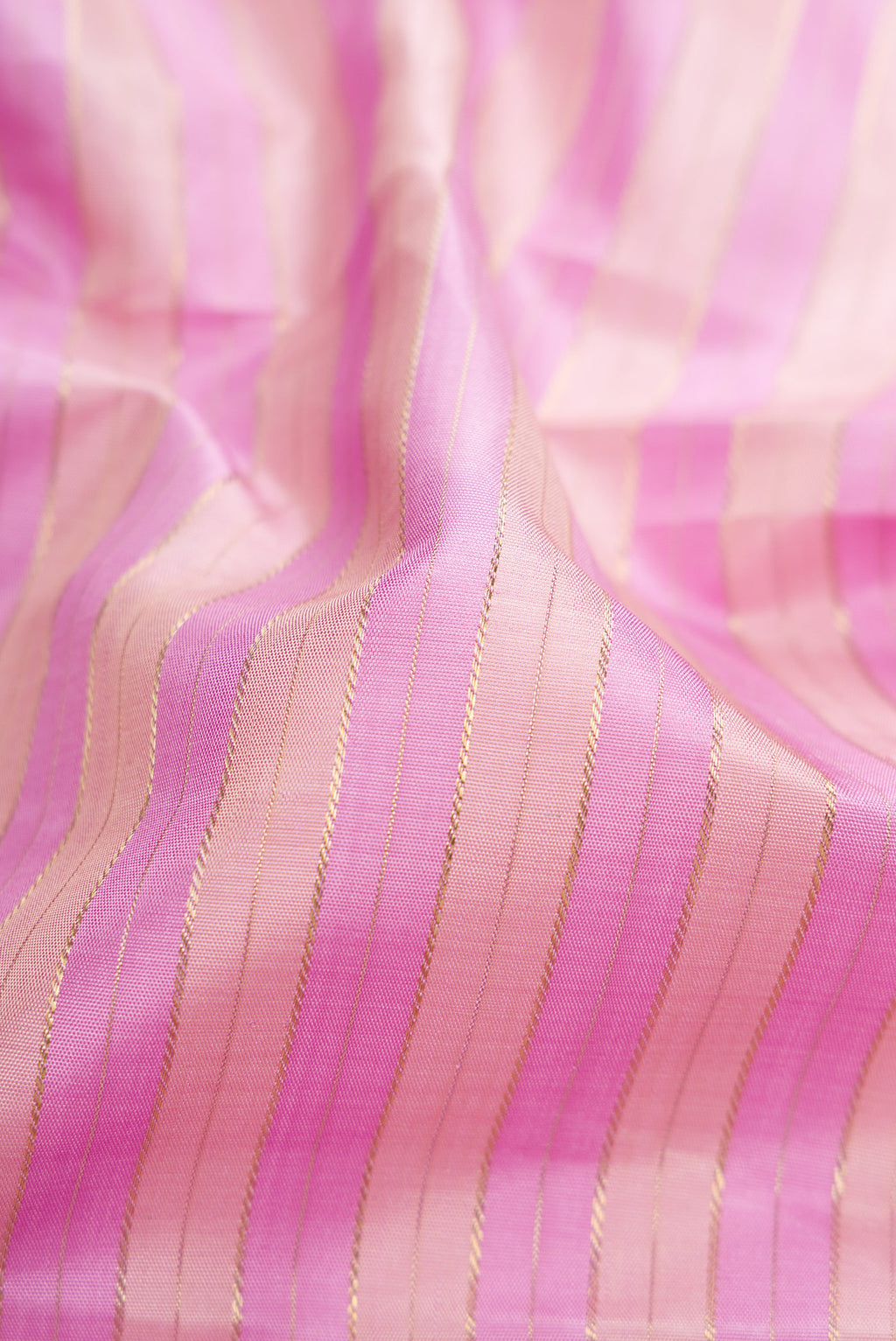 Close up of Pure Silk Pure Zari Lavender Kanjivaram Saree with Stripes on the body and Zari Border.  displaying folds