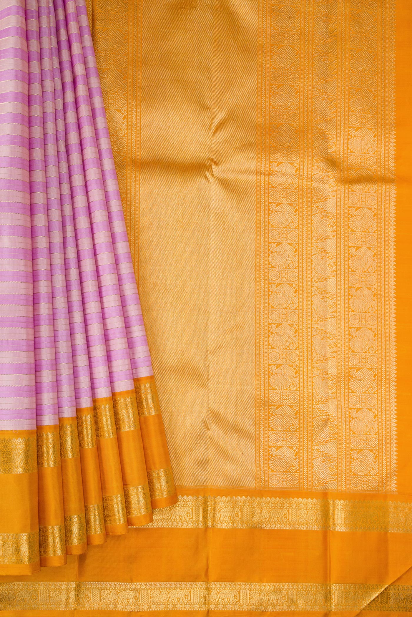 Pleats and pallu of Pure Silk Pure Zari Lavender Kanjivaram Saree with Stripes on the body and Zari Border. 