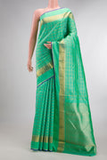 Pure Silk Pure Zari Sea Green Dual Tone Kanjivaram Saree with Checked design on the body and Zari Border.  displayed on a mannequin