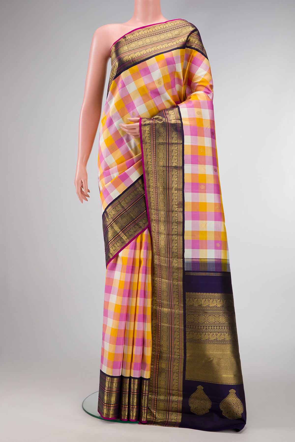 Pure Silk Pure Zari Mustard, Pink and Off White Color Kanjivaram Saree with Checked design on the body and Zari Border.  displayed on a mannequin