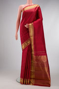Pure Silk Pure Zari Maroon Dual Tone Kanjivaram Saree with Jacquard design on the body and Zari Border.  displayed on a mannequin