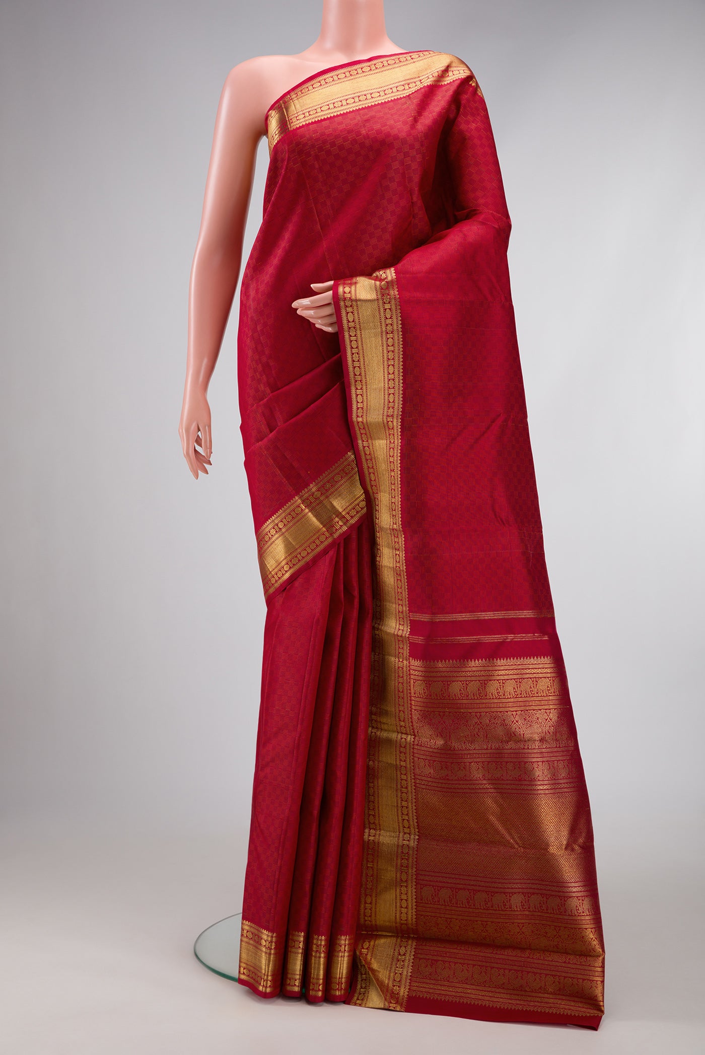 Pure Silk Pure Zari Maroon Dual Tone Kanjivaram Saree with Jacquard design on the body and Zari Border.  displayed on a mannequin