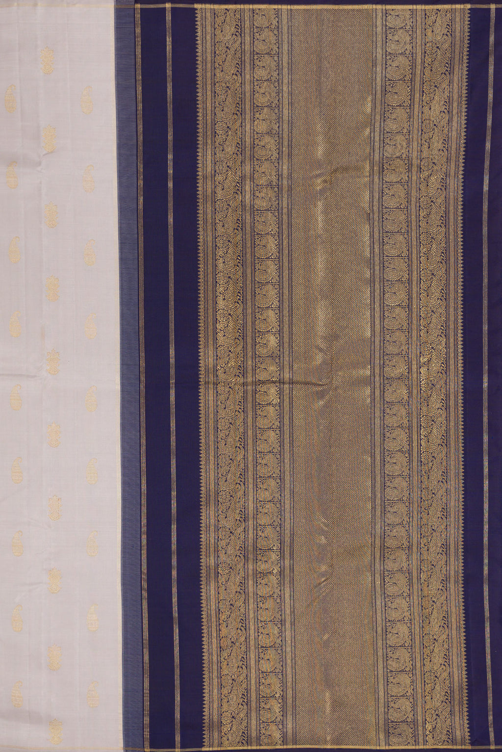 Close up image of the pallu of Pure Silk Pure Zari Grey Kanchipuram Saree with Zari Butta on the body and Thin Zari Line. 