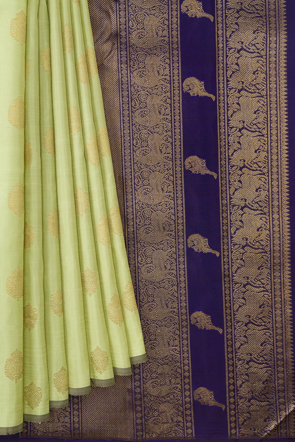 Pleats and pallu of Pure Silk Pure Zari Pista Green Dual Tone Kanchipuram Saree with Zari Butta on the body and Without Border. 