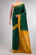 Pure Silk Pure Zari Bottle Green Kanjivaram Saree with Zari Butta on the body and Zari Border.  displayed on a mannequin
