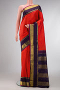 Pure Silk Pure Zari Orange Dual Tone Kanjivaram Saree with Thread Butta on the body and Zari Border.  displayed on a mannequin