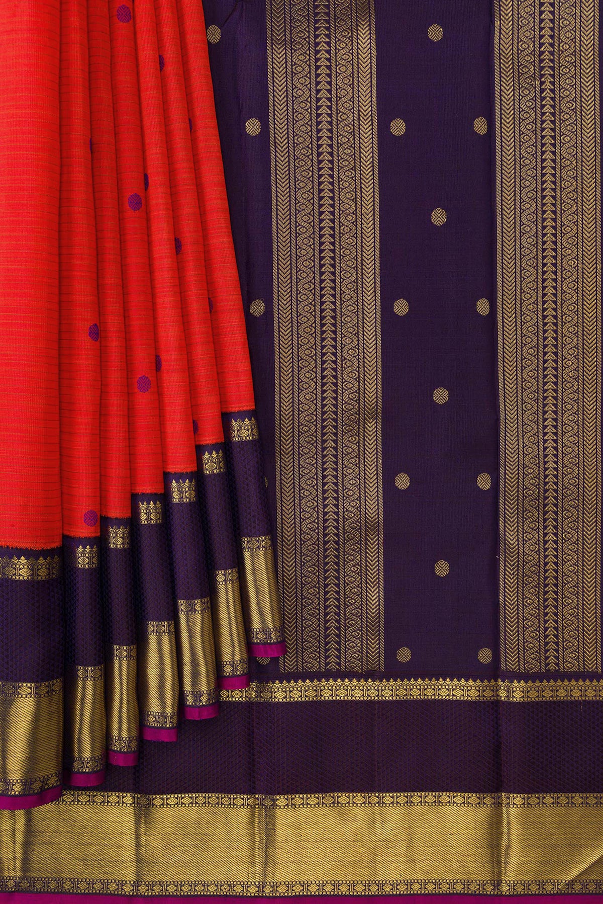 Pleats and pallu of Pure Silk Pure Zari Orange Dual Tone Kanjivaram Saree with Thread Butta on the body and Zari Border. 
