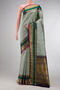 Pure Silk Pure Zari Grey Dual Tone Kanjivaram Saree with Stripes on the body and Zari Border.  displayed on a mannequin