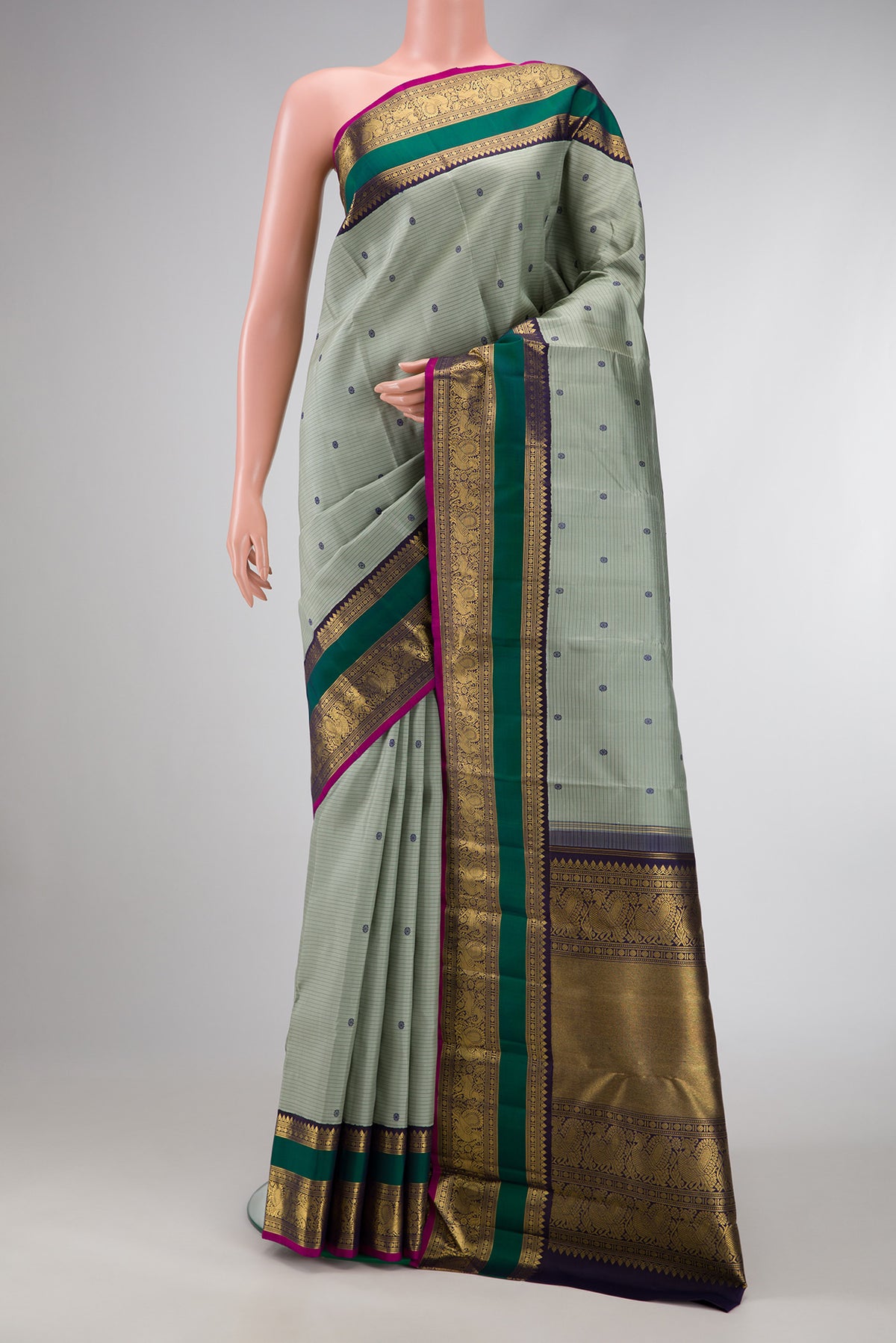 Pure Silk Pure Zari Grey Dual Tone Kanjivaram Saree with Stripes on the body and Zari Border.  displayed on a mannequin