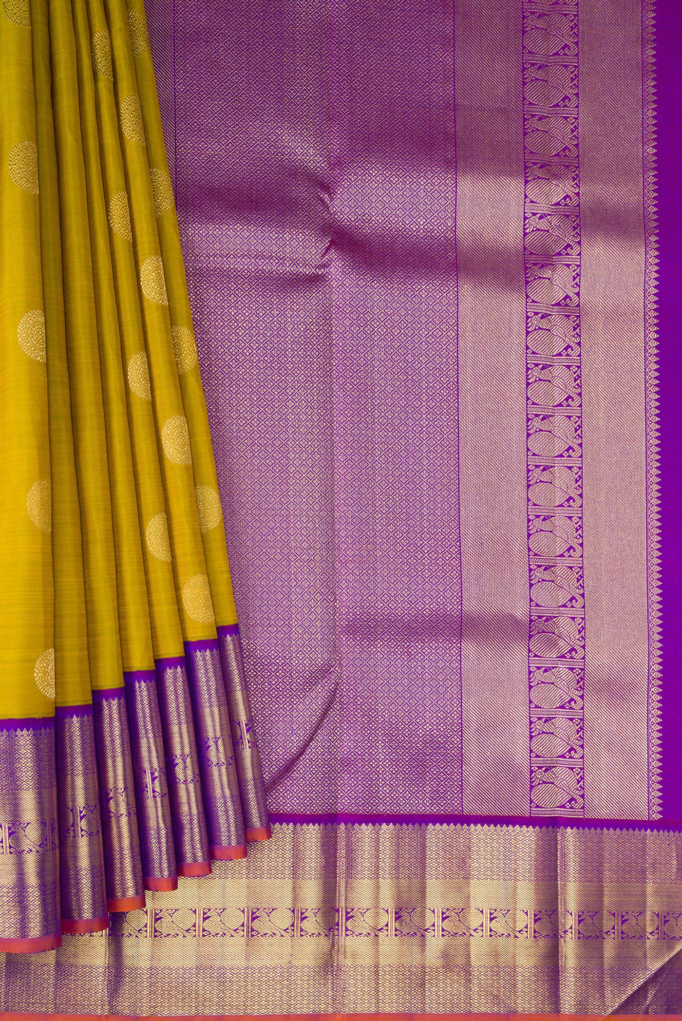 Pleats and pallu of Pure Silk Pure Zari Mehandi Green Kanjivaram Saree with Zari Butta on the body and Zari Border. 