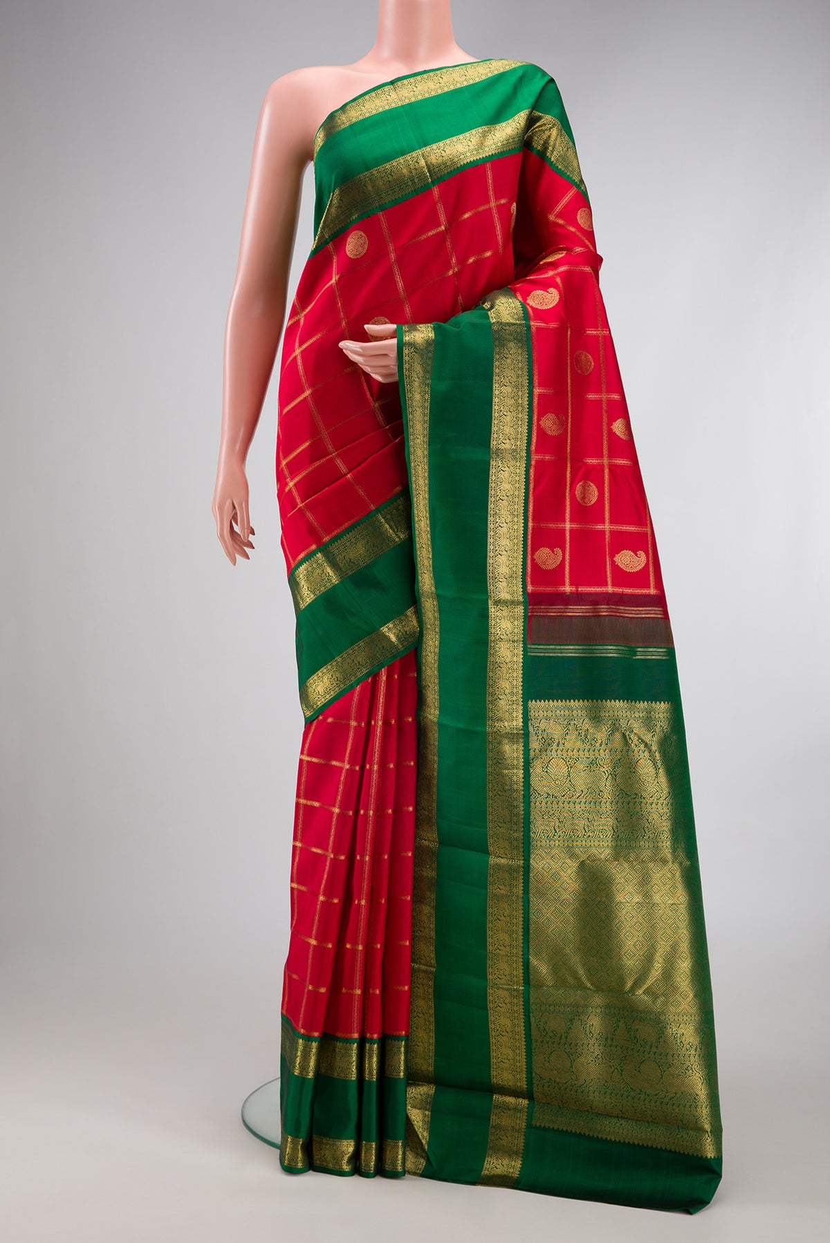 Pure Silk Pure Zari Deep Red Kanjivaram Saree with Checked design on the body and Zari Border.  displayed on a mannequin