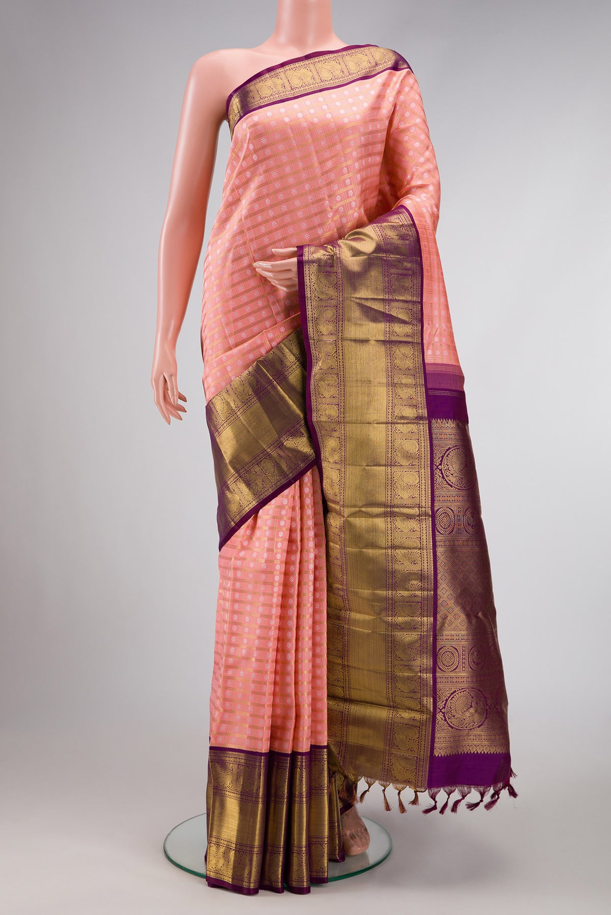 Pure Silk Pure Zari Pink Dual Tone Kanjivaram Saree with Zari Brocade on the body and Zari Border.  displayed on a mannequin
