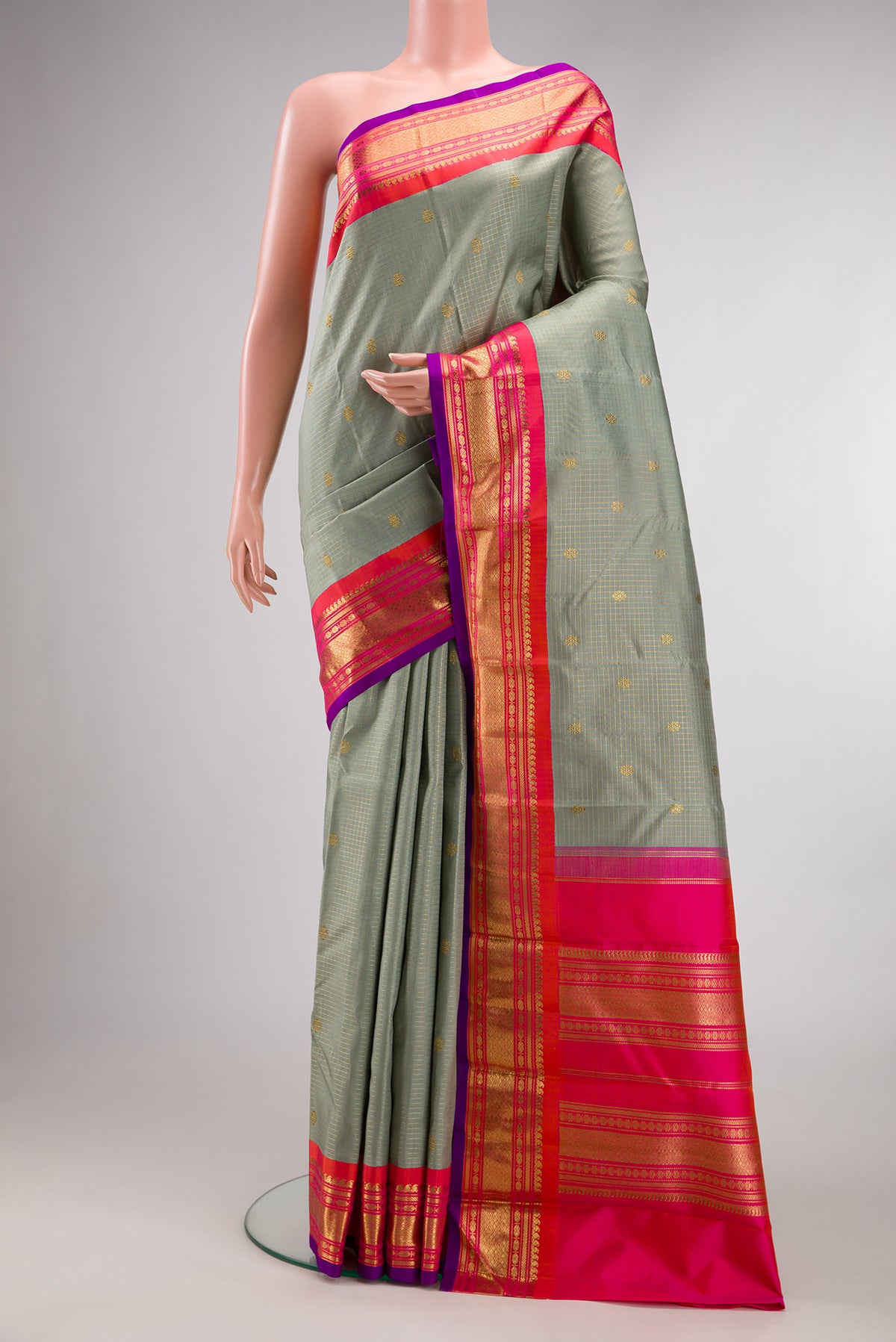 Pure Silk Pure Zari Grey Kanjivaram Saree with Checked design on the body and Zari Border.  displayed on a mannequin