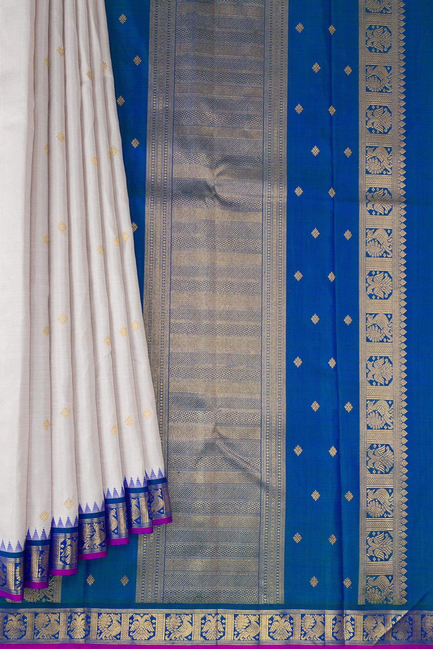 Pleats and pallu of Pure Silk Pure Zari Grey Kanjivaram Saree with Zari Butta on the body and Zari Border. 