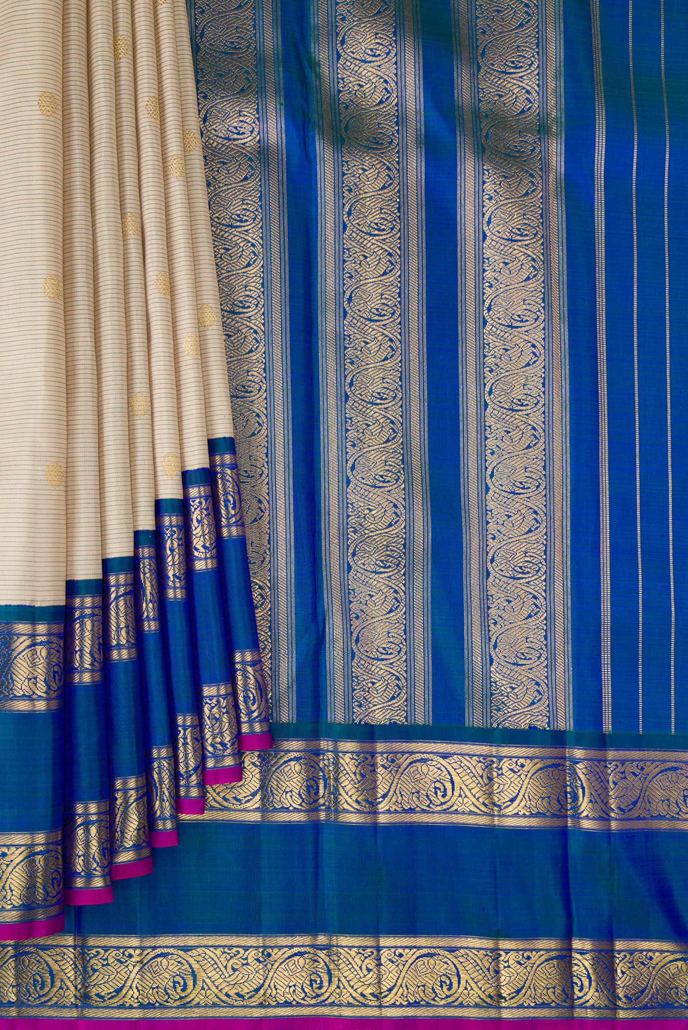 Pleats and pallu of Pure Silk Pure Zari Cream Kanjivaram Saree with Zari Butta on the body and Zari Border. 