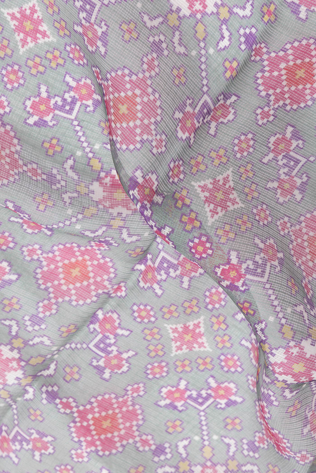 Close up of Green Dual Tone Kota Silk Saree with Printed design on the body and Zari Border.  displaying folds