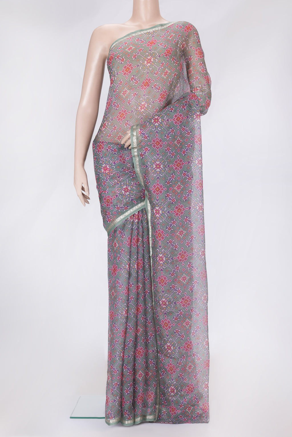 Green Dual Tone Kota Silk Saree with Printed design on the body and Zari Border.  displayed on a mannequin