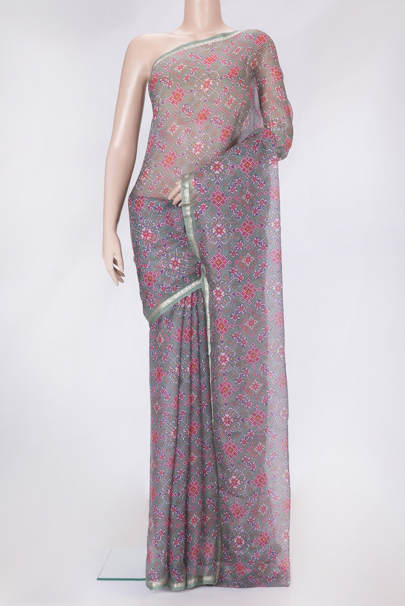 Green Dual Tone Kota Silk Saree with Printed design on the body and Zari Border.  displayed on a mannequin