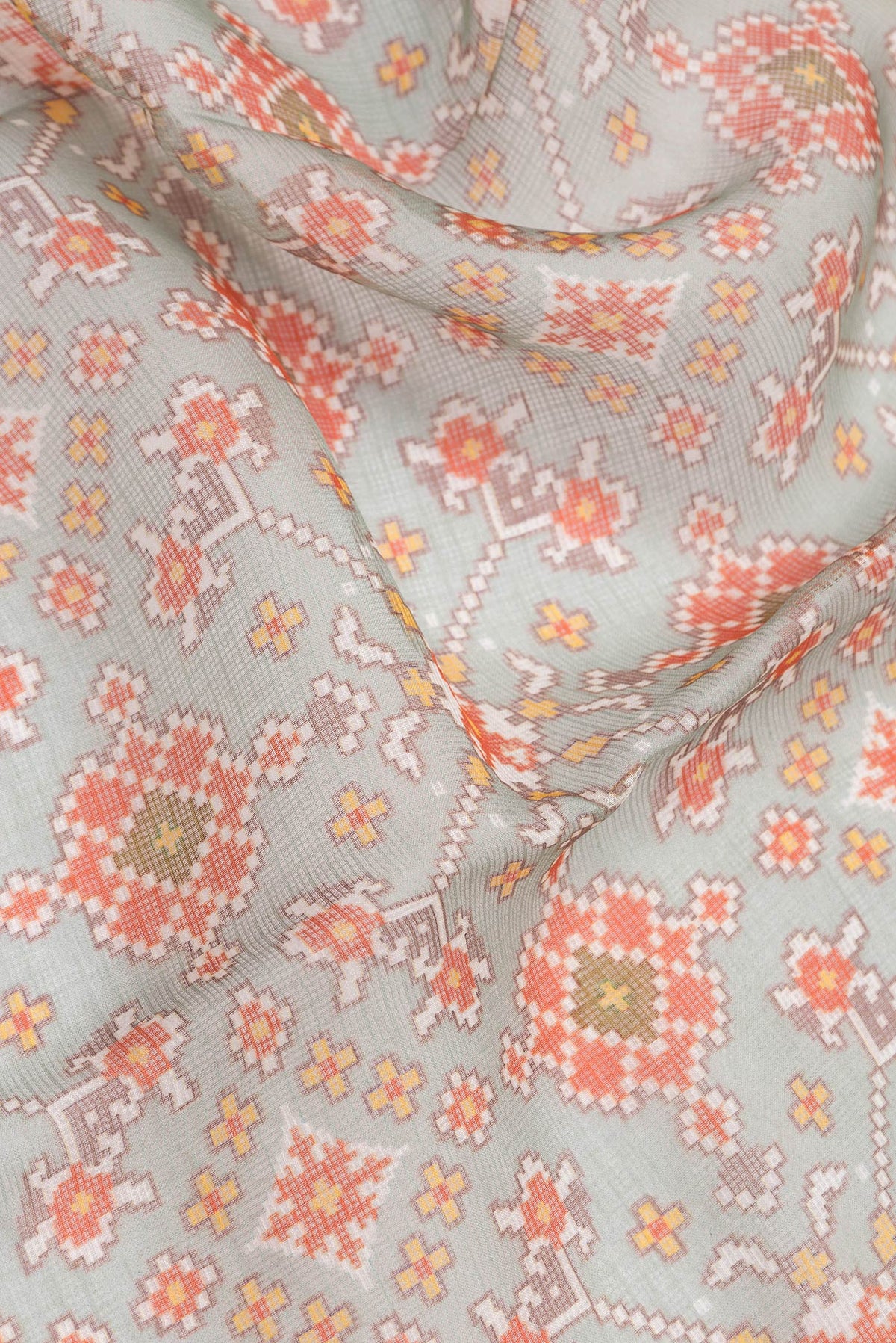 Close up of Sea Green Dual Tone Kota Silk Saree with Printed design on the body and Zari Border.  displaying folds