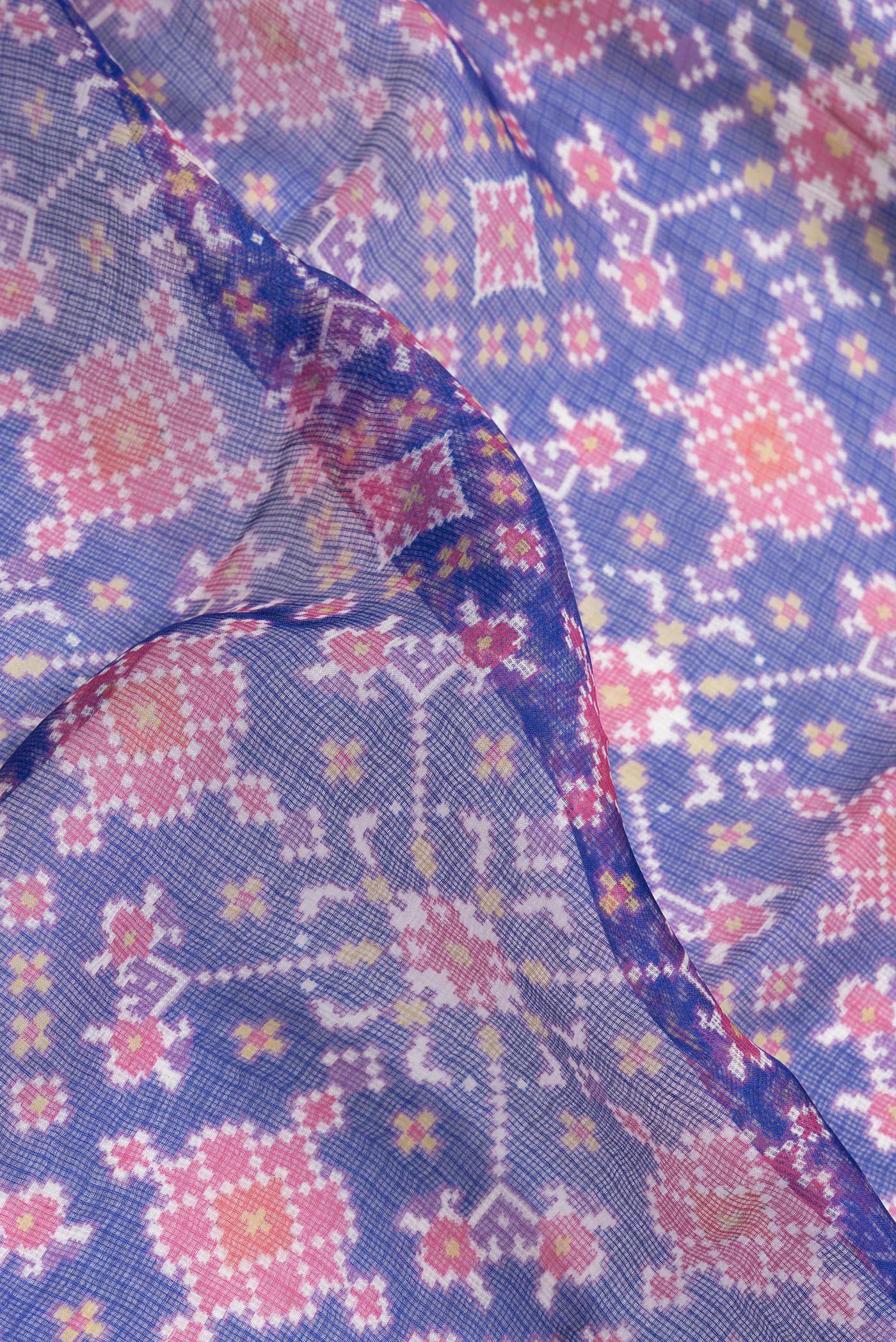 Close up of Royal Blue Dual Tone Kota Silk Saree with Ikat Print on the body and Zari Border.  displaying folds