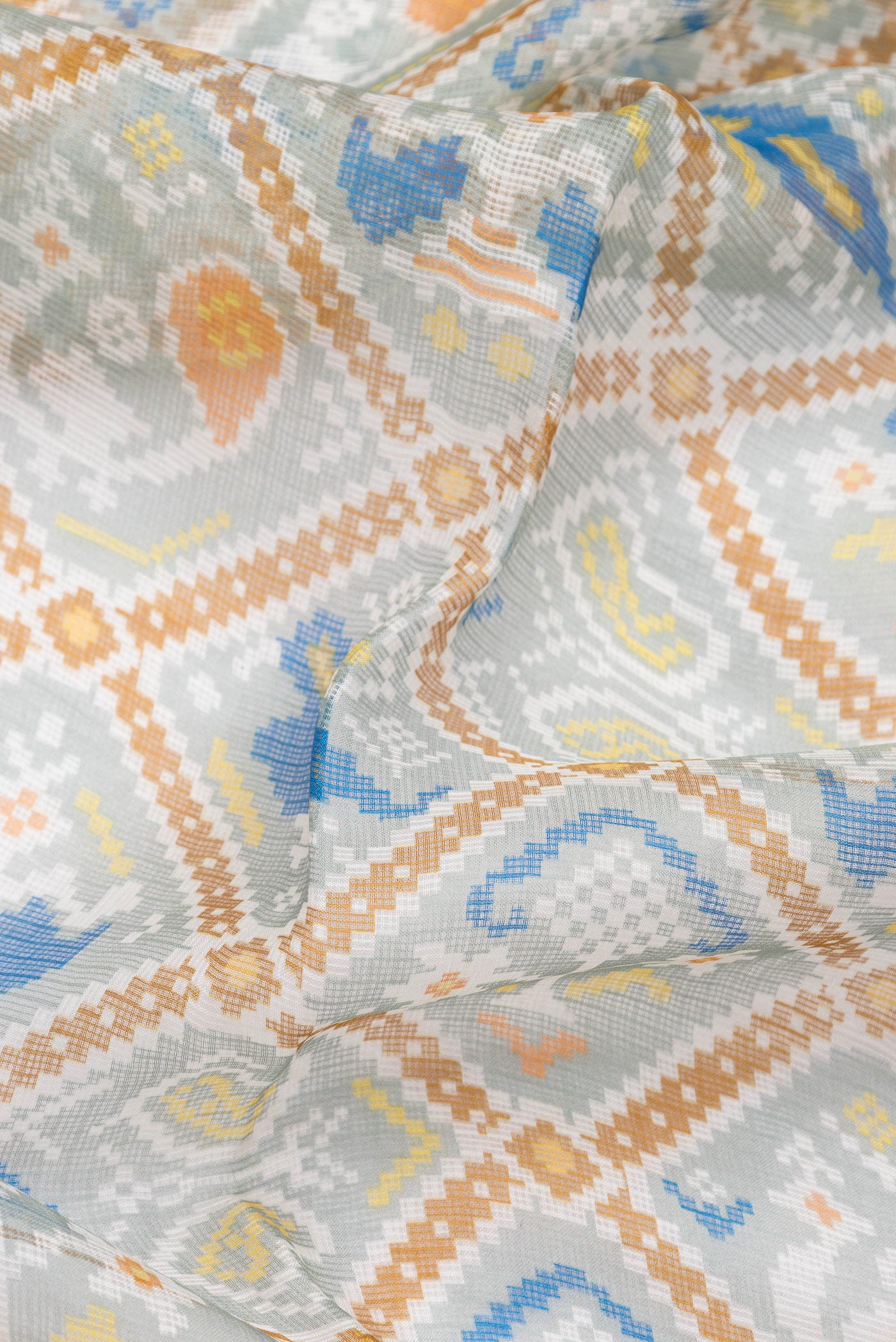 Close up of Sea Green Dual Tone Kota Silk Saree with Printed design on the body and Zari Border.  displaying folds