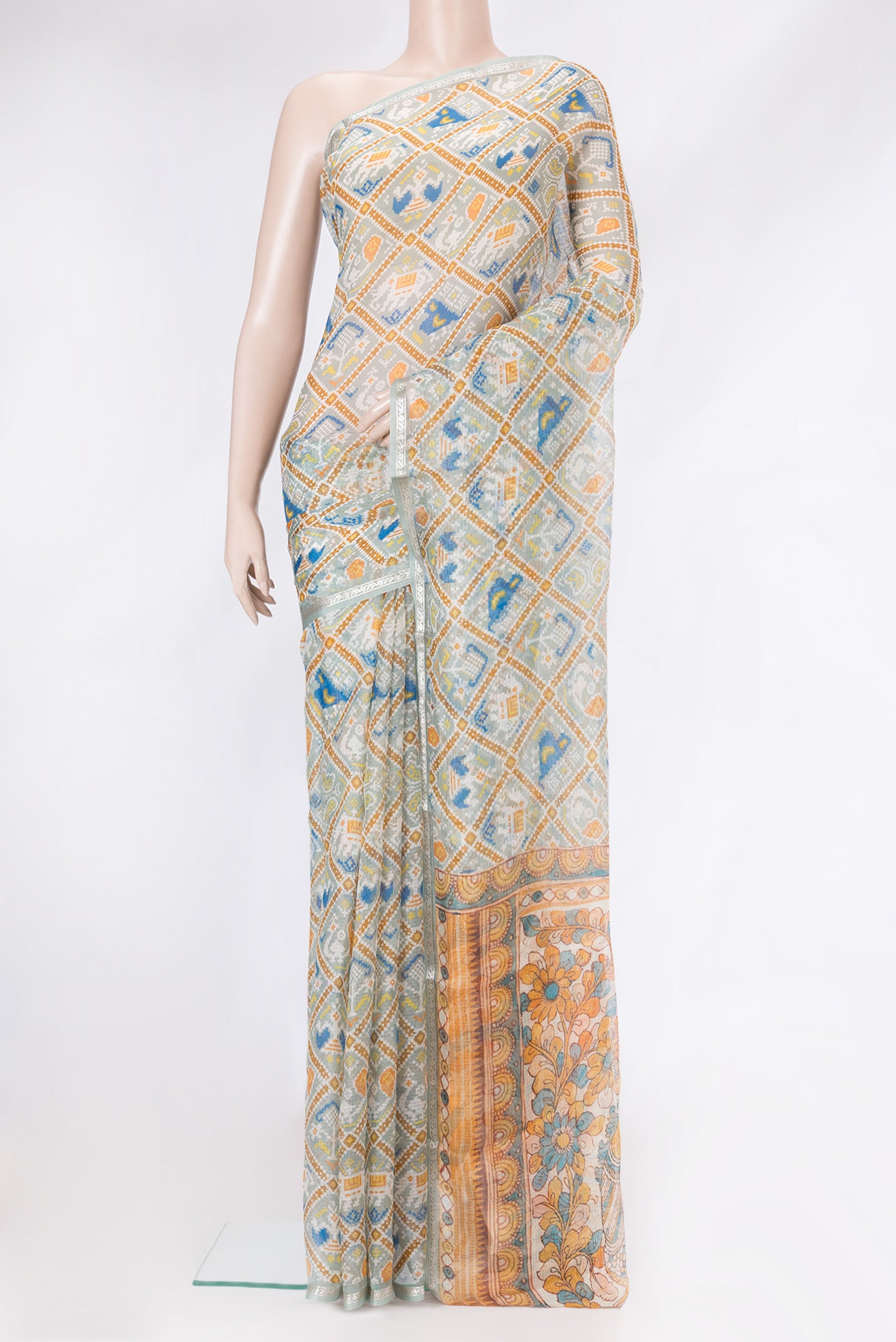 Sea Green Dual Tone Kota Silk Saree with Printed design on the body and Zari Border.  displayed on a mannequin