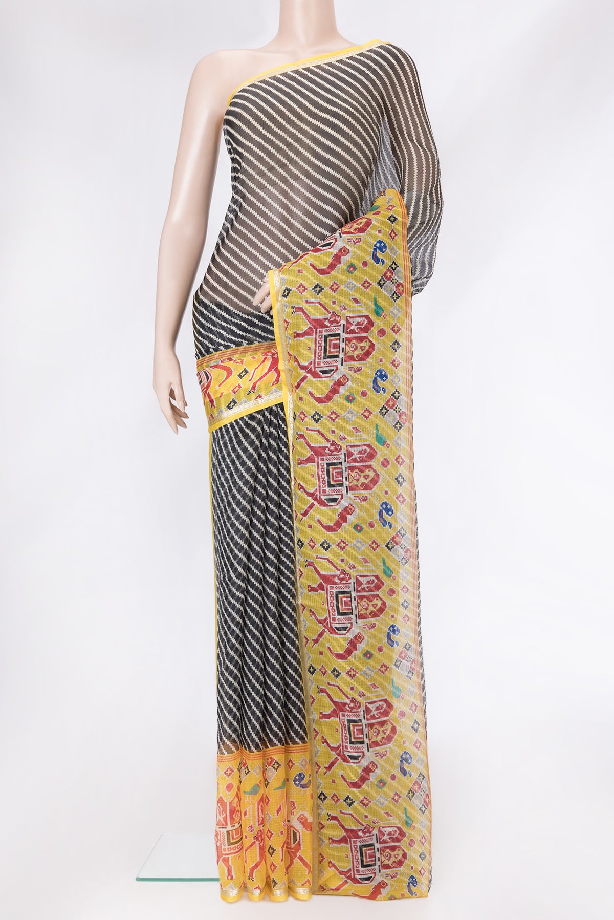 Black Dual Tone Kota Silk Saree with Printed design on the body and Fancy Border.  displayed on a mannequin