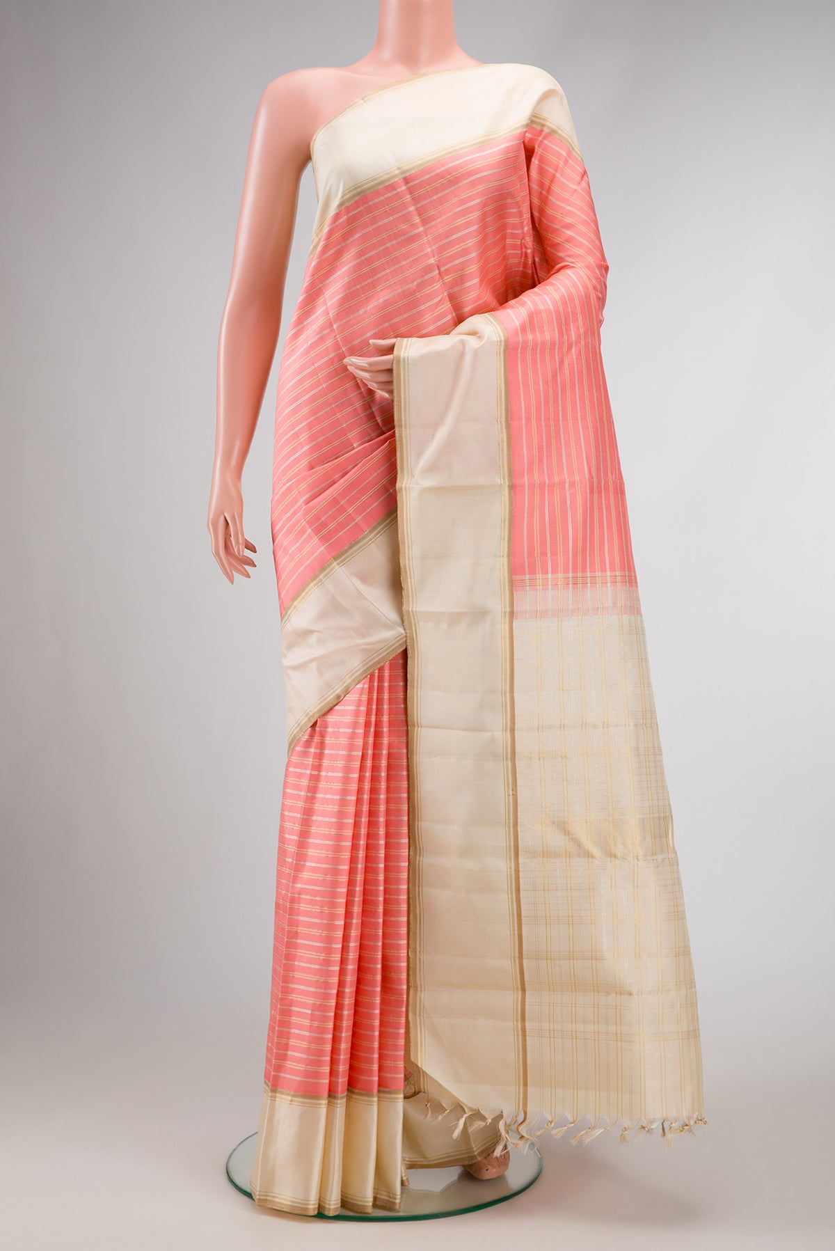 Pure Silk Pure Zari Peach Dual Tone Kanjivaram Saree with Stripes on the body and Zari Border.  displayed on a mannequin