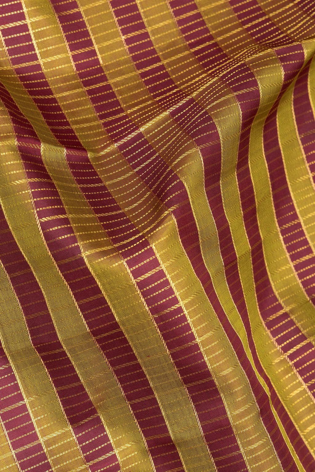Close up of Pure Silk Multi Color Kanchipuram Saree with Checked design on the body and Zari Border.  displaying folds