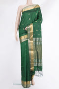 Pure Silk Bottle Green Dual Tone Soft Saree with Zari Butta on the body and Zari Border.  displayed on a mannequin