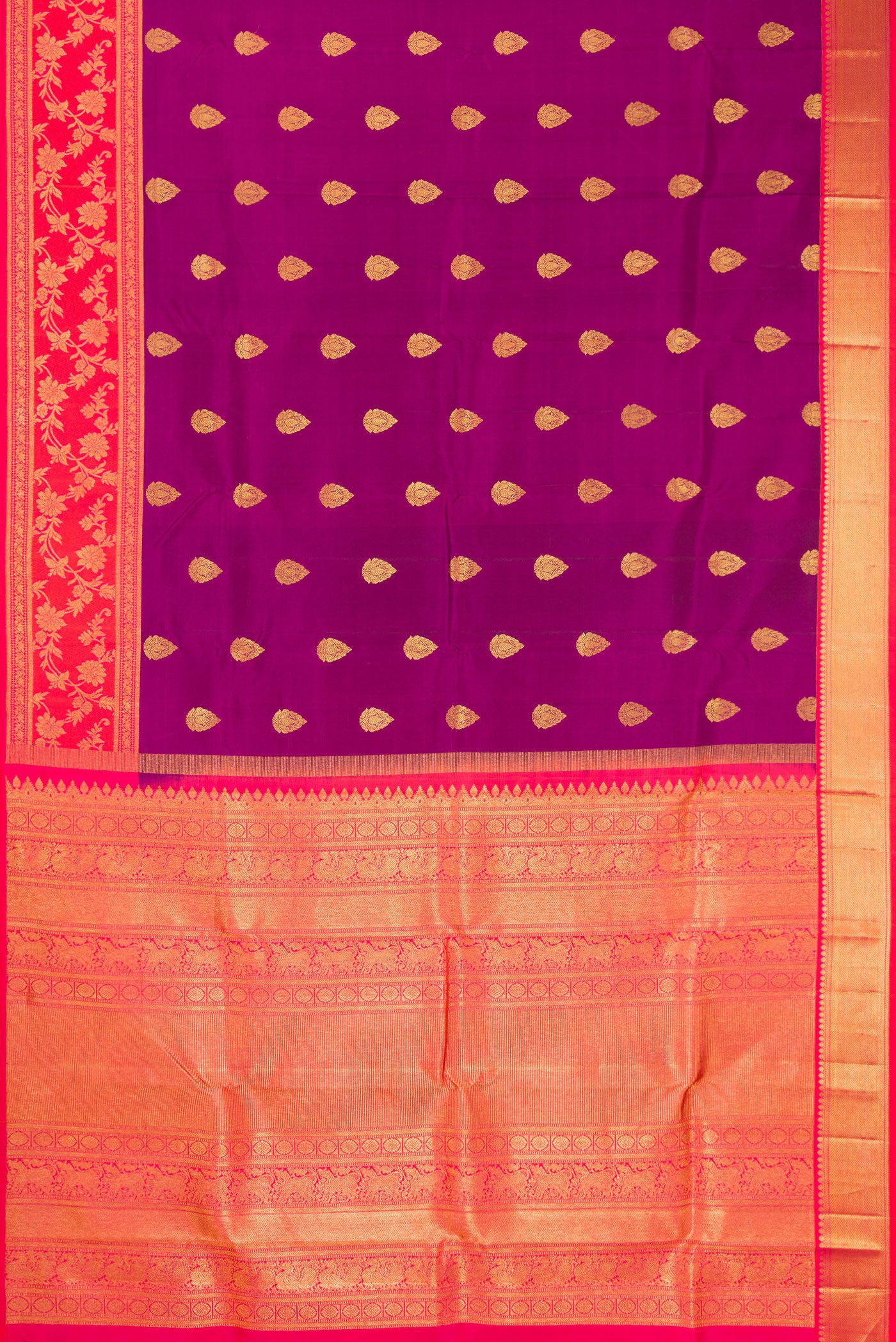 Flat view of Purple Kanjivaram Silk Saree with Zari Butta on the body and Fancy Border. 