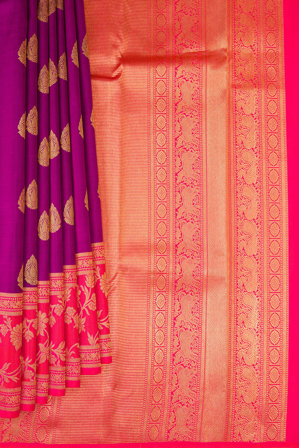 Pleats and pallu of Purple Kanjivaram Silk Saree with Zari Butta on the body and Fancy Border. 