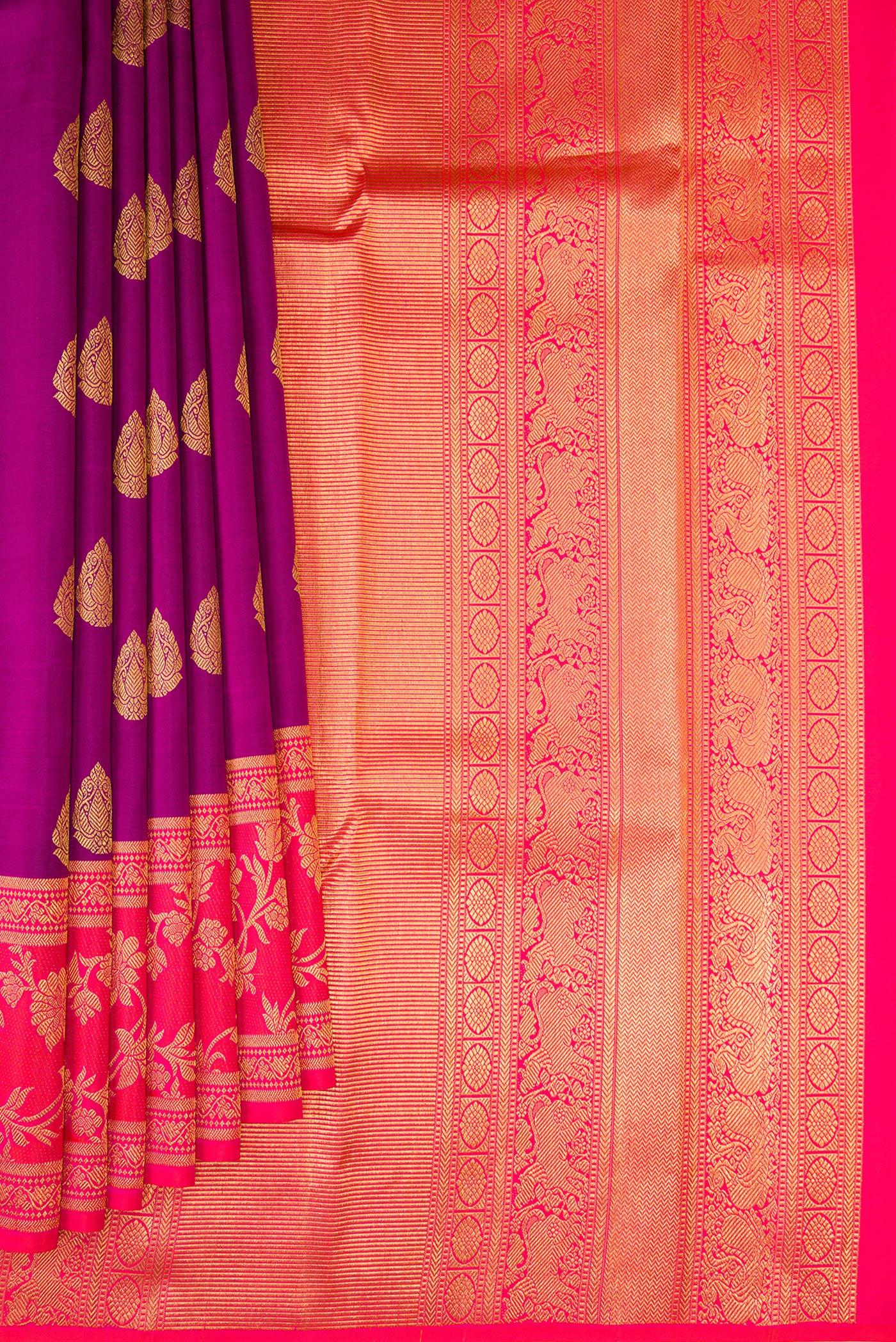 Pleats and pallu of Purple Kanjivaram Silk Saree with Zari Butta on the body and Fancy Border. 