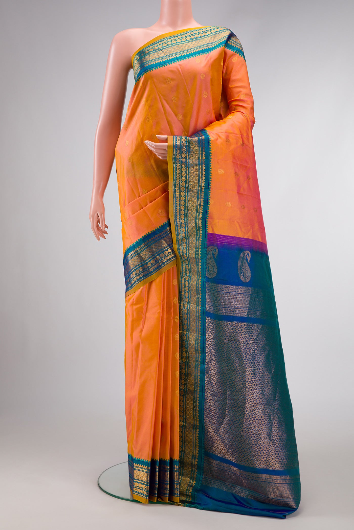 Coral Dual Tone Gadwal Silk Saree with Zari Butta on the body and Zari Border.  displayed on a mannequin