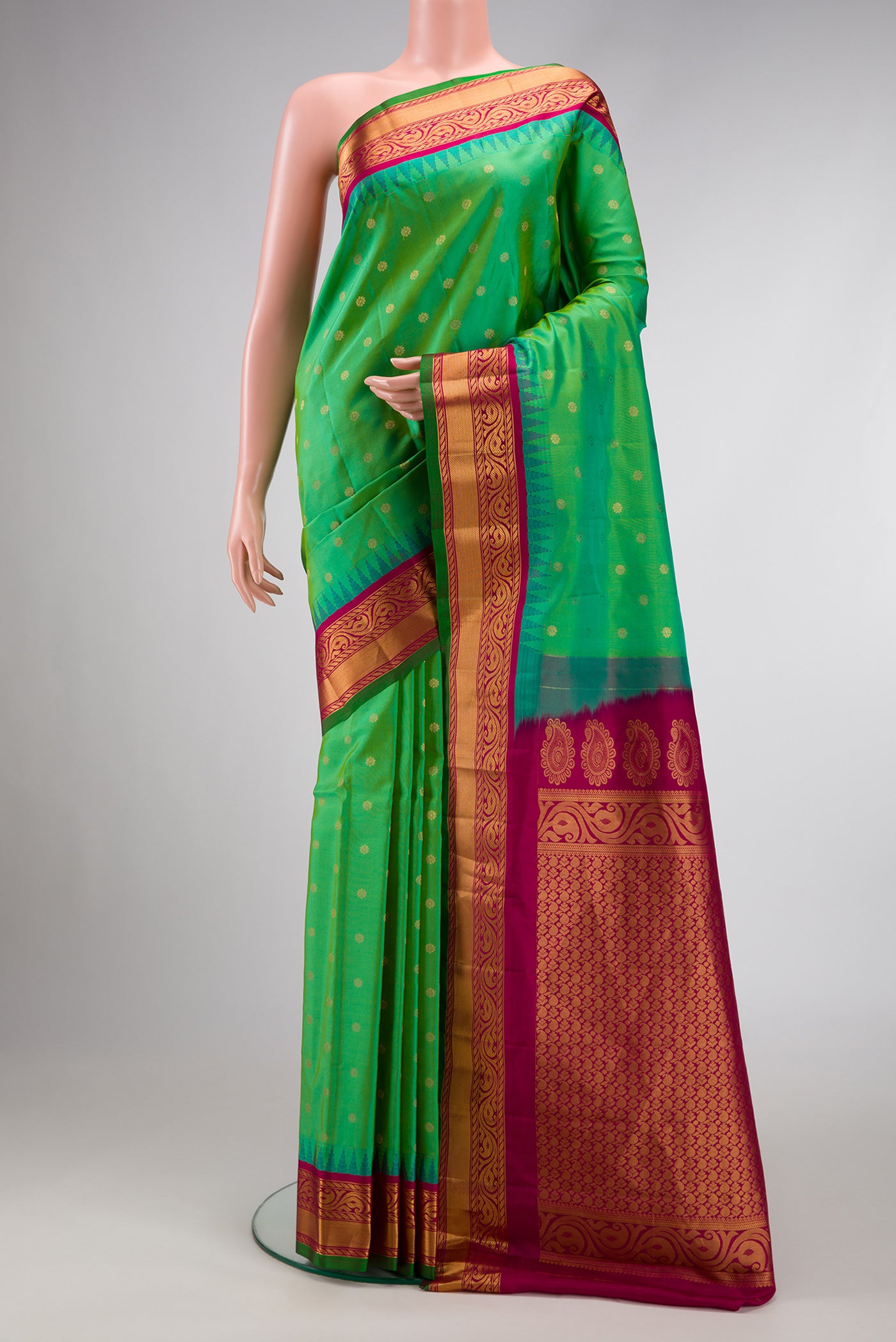 Green Dual Tone Gadwal Silk Saree with Zari Butta on the body and Zari Border.  displayed on a mannequin